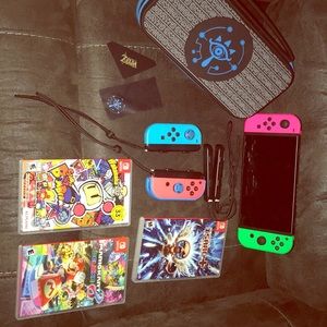 Nintendo Switch + 4 controllers + games + case NIB